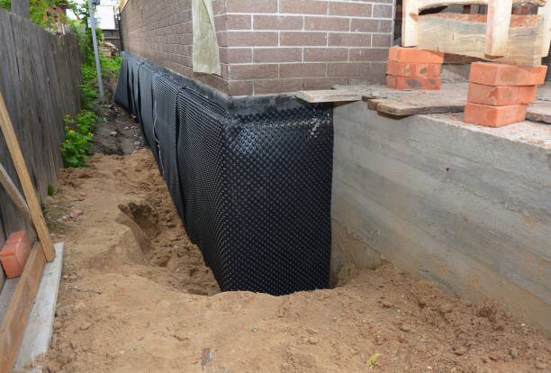 SJ Waterproofing Pros technician performing targeted Waterproofing assessment in Winfield, AL